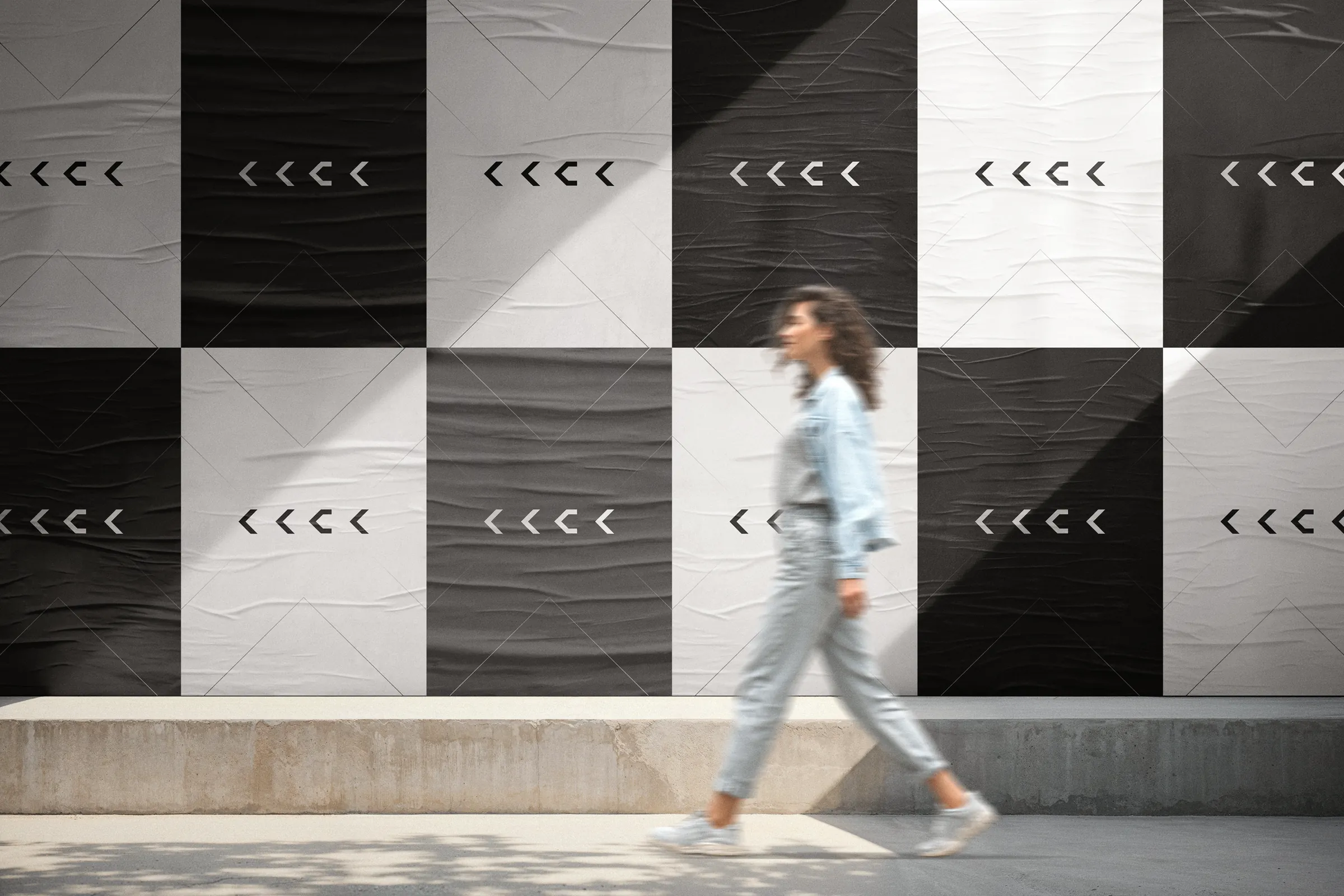 A wall of KKSK posters in a chequerboard layout with a formation of chevrons
