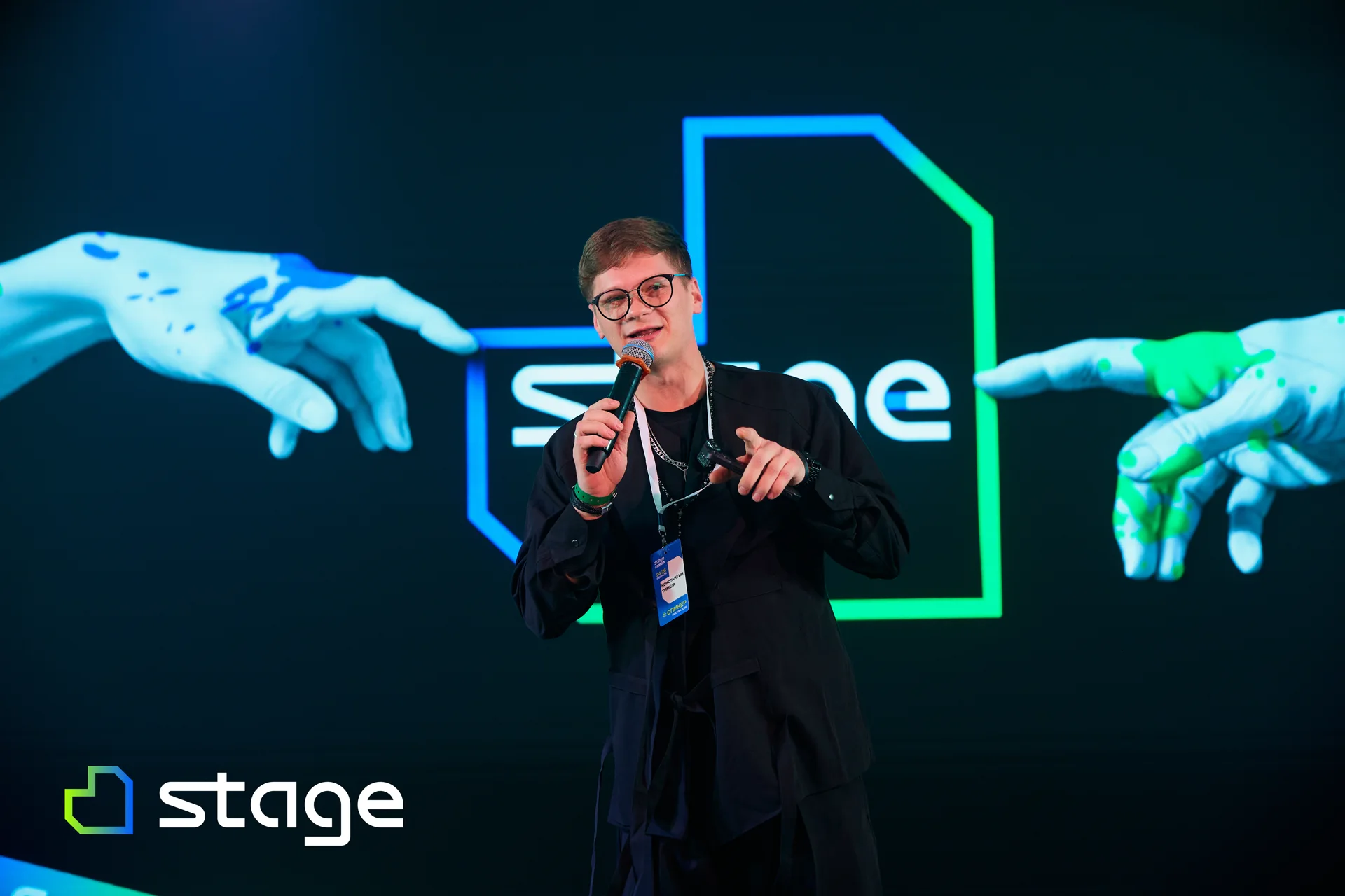 A speaker on the Stage stage in front of the mark