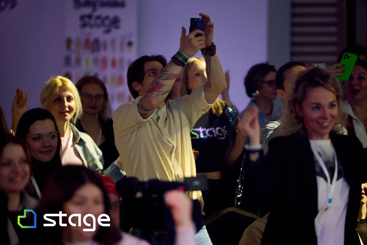 Participants filming the performance on their phones